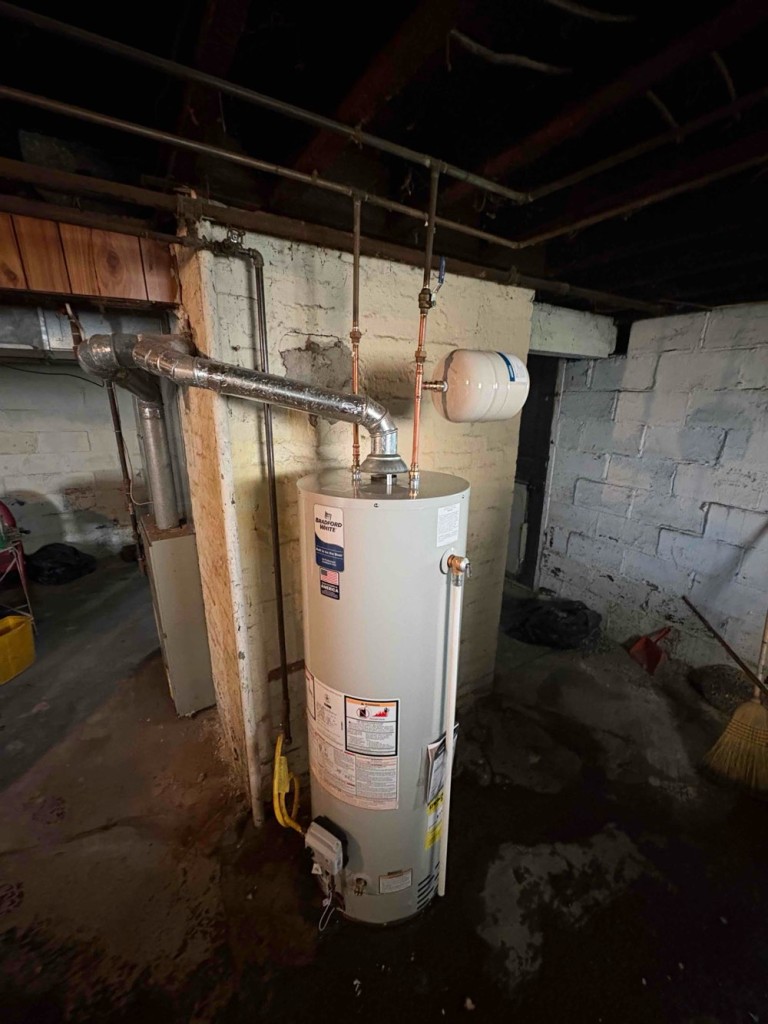 After photo of a new water heater installation with cleaner layout and updated connections