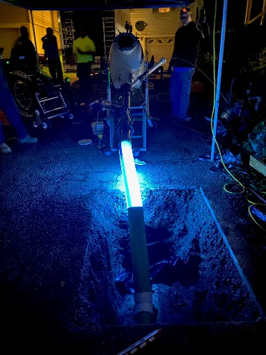 John Shelton Plumbing UV curing equipment illuminating a trenchless pipe liner