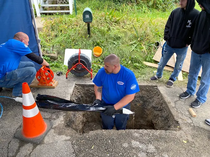 John Shelton Plumbing technicians working together in the field
