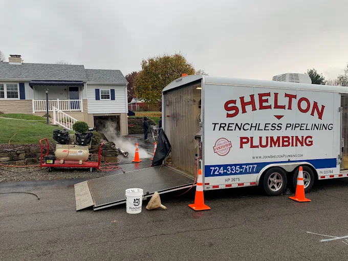 John Shelton Plumbing trenchless service vehicle at a residential project